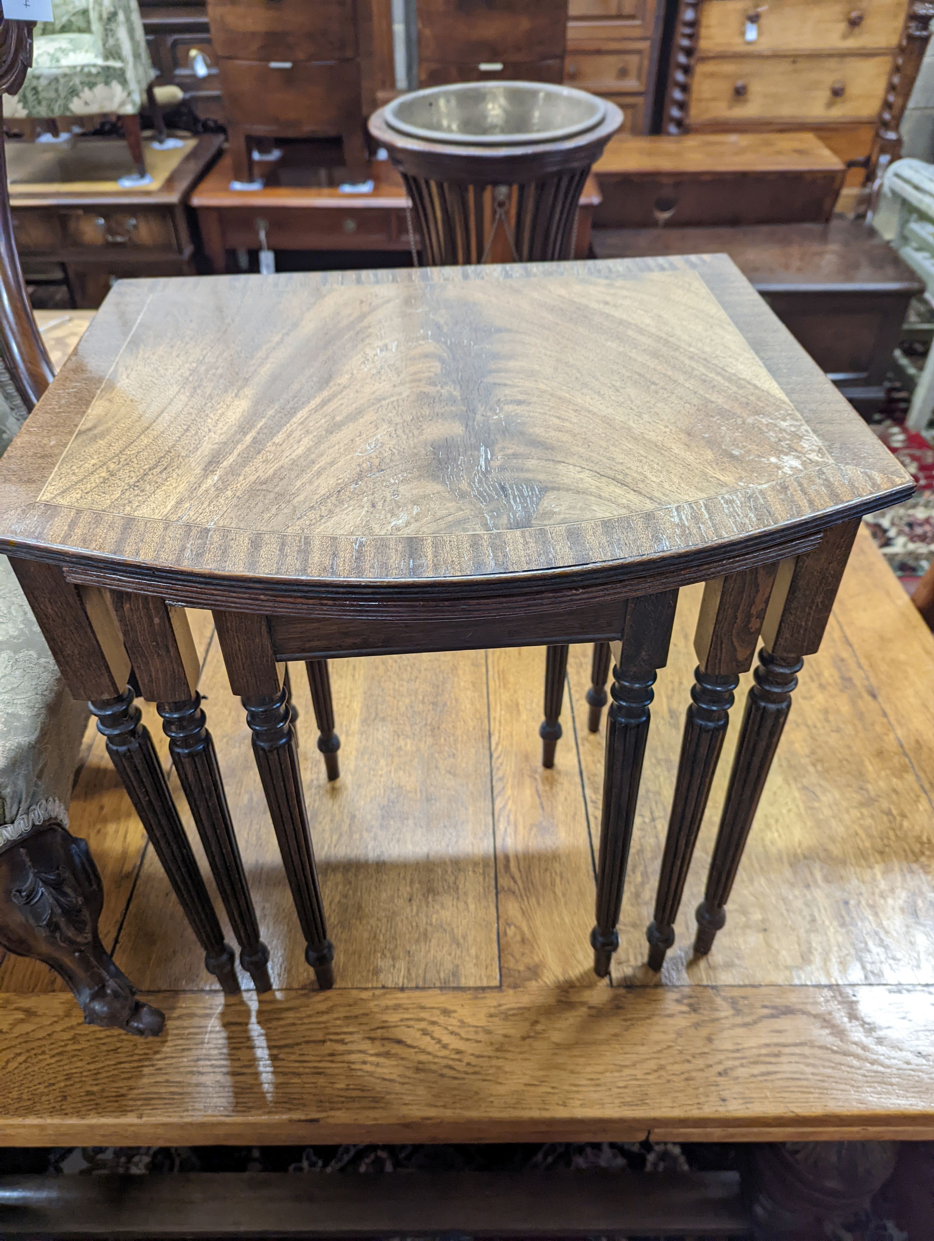 A Victorian walnut nursing chair together with a reproduction nest of tea tables